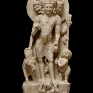 Three_headed_Shiva_with_Nandi_Prithvi_and_a_gana-North-west_India-Punjab-Salt_Hills-7th_8th_C-limestone-ht_58cmJohn_Eskenazi