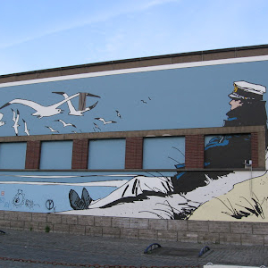 L’un des quatre tableaux de la fresque géante, dédiée à Hugo Pratt © asbl « Art mural »